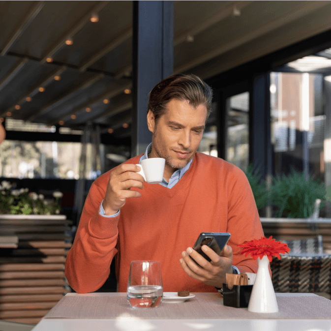Hotel Customer looking at his mobile