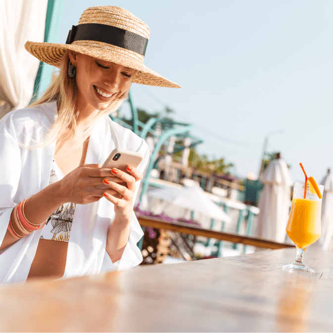 Woman at Beach Bar with mobile